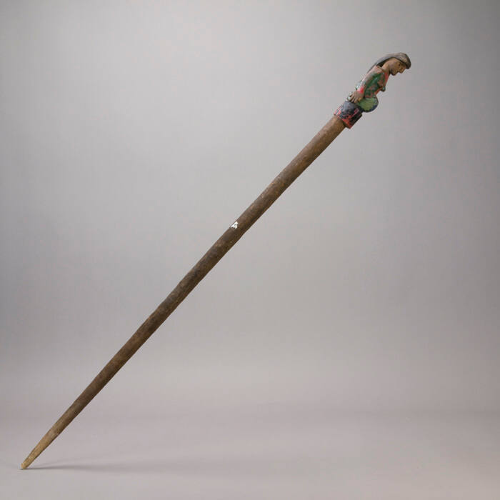 Staff, female figure